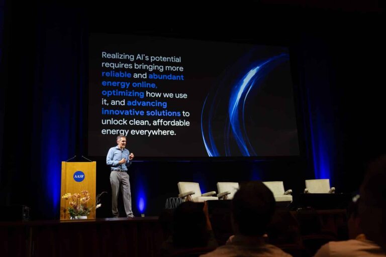 Keynote speaker presents on AI infrastructure at Stanford Memorial Auditorium