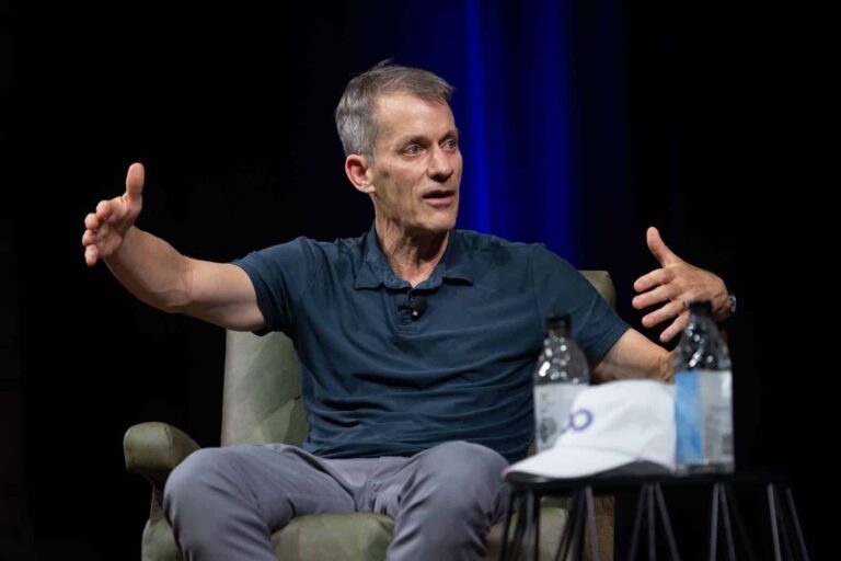 Jeff Dean gestures while answering a question during the 2026 Frontier Symposium keynote fireside chat