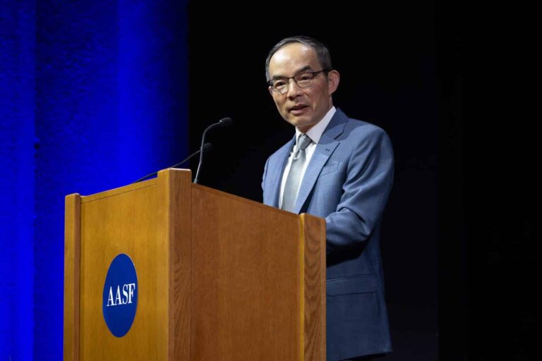 Session chair delivers opening remarks at the 2026 AASF Frontier Symposium, Stanford Memorial Auditorium