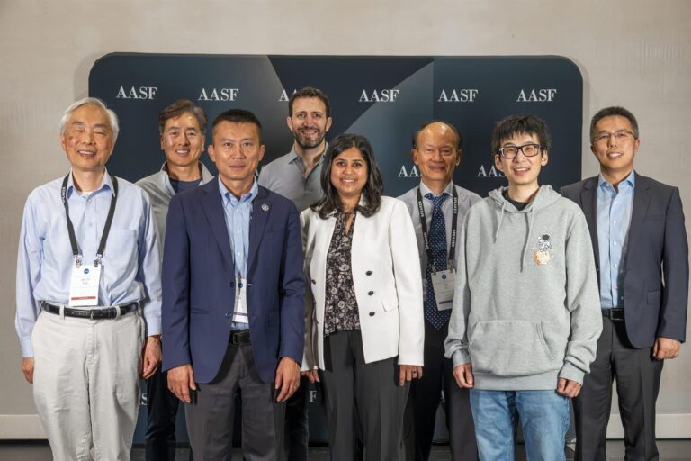 A research roundtable group photo at the 2026 Symposium