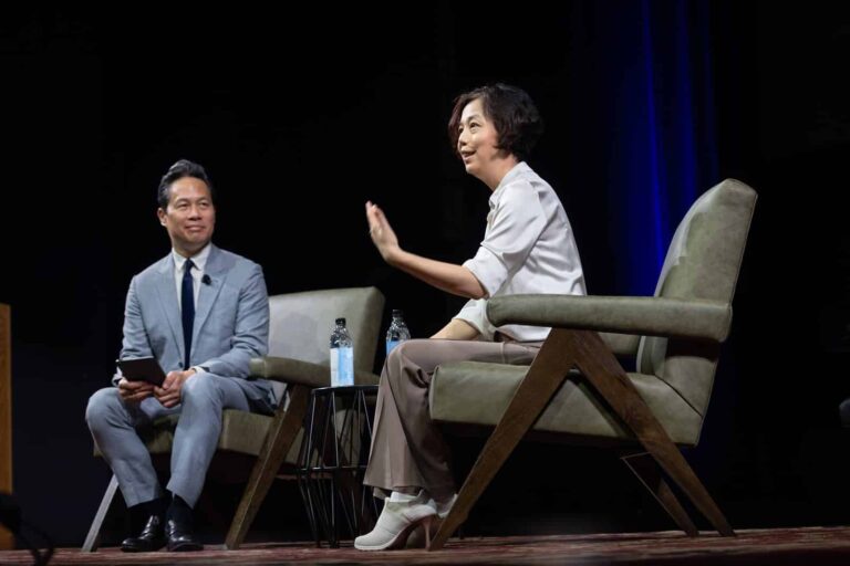 Fei-Fei Li speaks with host Richard Lui during her keynote fireside chat at the 2026 Pioneer Symposium