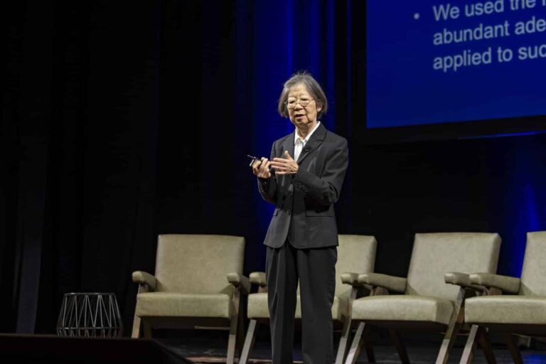 A keynote speaker presents at the 2026 Pioneer Symposium