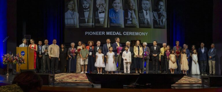 Medalists, their families and presenters on stage at the close of the 2026 Pioneer and Justice Medal Ceremony, Stanford Memorial Auditorium